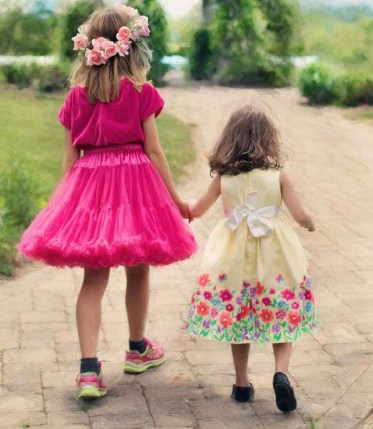 children wearing pink ball dress