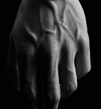 grayscale photo of person wearing round analog watch