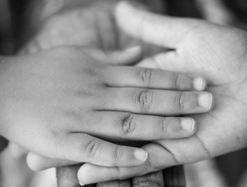grayscale photo of man woman and child